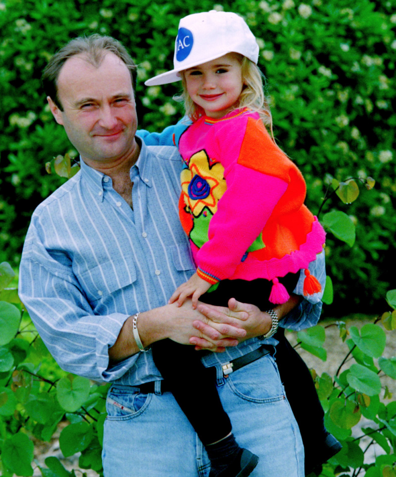 "Emily In Paris" star Lily Collins net worth - Portrait of musician Phil Collins with daughter Lily Collins, while on tour in Japan, circa 1988. (Photo by Dave Hogan/Hulton Archive/Getty Images)