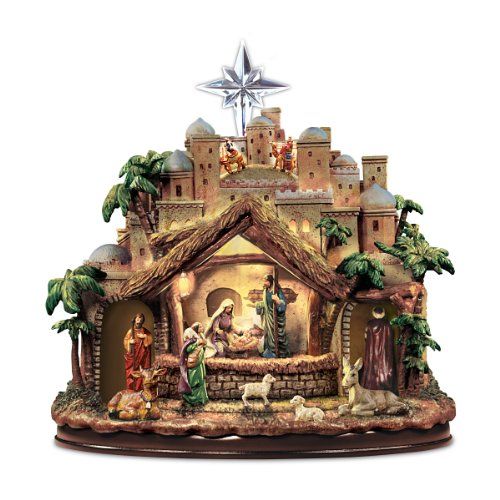 Ο Thomas Kinkade ακολουθεί τα φώτα γλυπτικής του Star Nativity καθώς οι φιγούρες μετακινούνται και η μουσική γέννηση παίζει 4 αγαπημένα κάλαντα! - από το Hawthorne Village